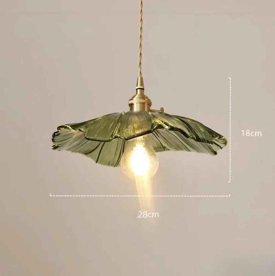Rumi Lotus Flower Pendant – elegant pendant lamp with a lotus-shaped glass shade, polished copper accents, and an exposed bulb design, available in four colorways.