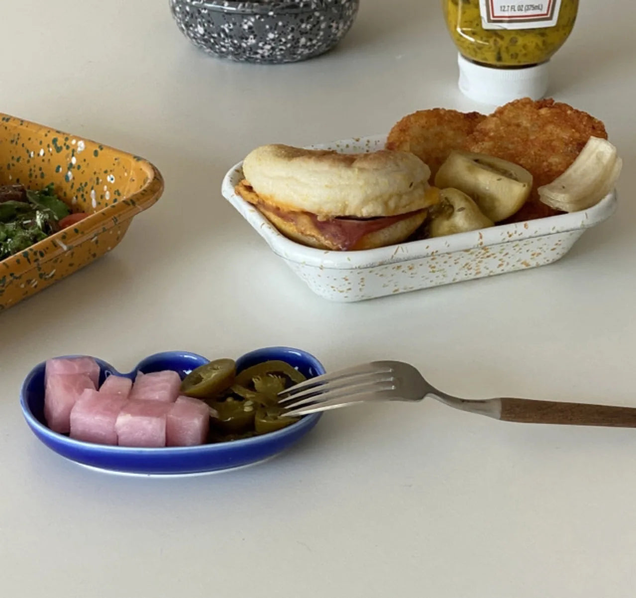 Handmade ceramic Rhett Dipping Dishes in bold vibrant colors, perfect for dipping and small bites. Four unique shapes provide versatility in presentation. Ideal for creating a mise en place. Shop now for artisanal charm in your dining experience.