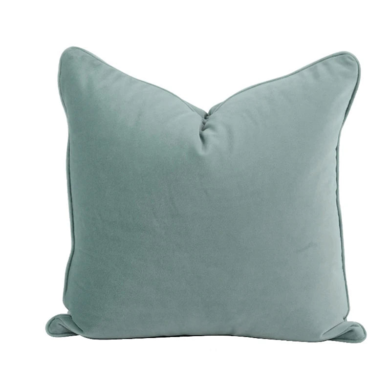 A collection of Bernadette Pillow Covers in various sizes and deep jewel tones, each crafted with a luxurious velvet feel. Made from 100% polyester, these pillow covers offer a rich and sophisticated look, perfect for home décor enthusiasts. Displayed on a sofa, the covers showcase their vibrant colorways and soft texture, ideal for adding elegance and comfort to any room. Pillow inserts are not included, allowing for customizable use and styling.