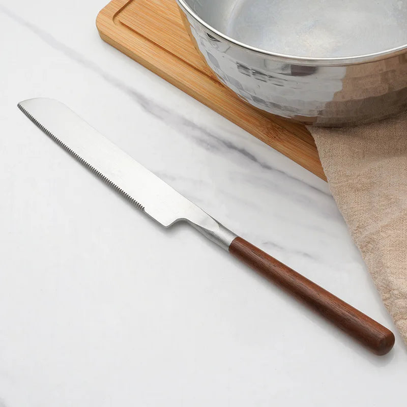 Wanda Serving Set – modern stainless steel serveware with elegant walnut handles, including a cake knife, cake shovel, serving spoon, ladle, and slotted turner for effortless entertaining.