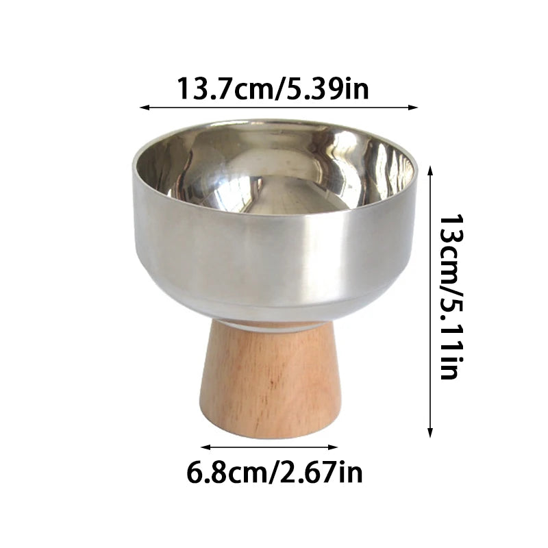 Eddard Serving Bowl featuring a modern design with a sleek stainless steel bowl and a sturdy wooden base. Compact and stylish, this small serving bowl is perfect for home decor enthusiasts looking to add a chic touch to their kitchen or coffee table. Ideal for serving snacks, fruits, or side dishes.