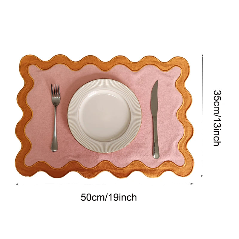 Image of the Paloma Placemat featuring a rectangular shape with a charming scalloped edge, designed for home décor enthusiasts. Made from a durable cotton double layer, it measures 35 x 50 cm and is available in four stylish colorways. Ideal for decorating dining tables with elegance and sophistication.
