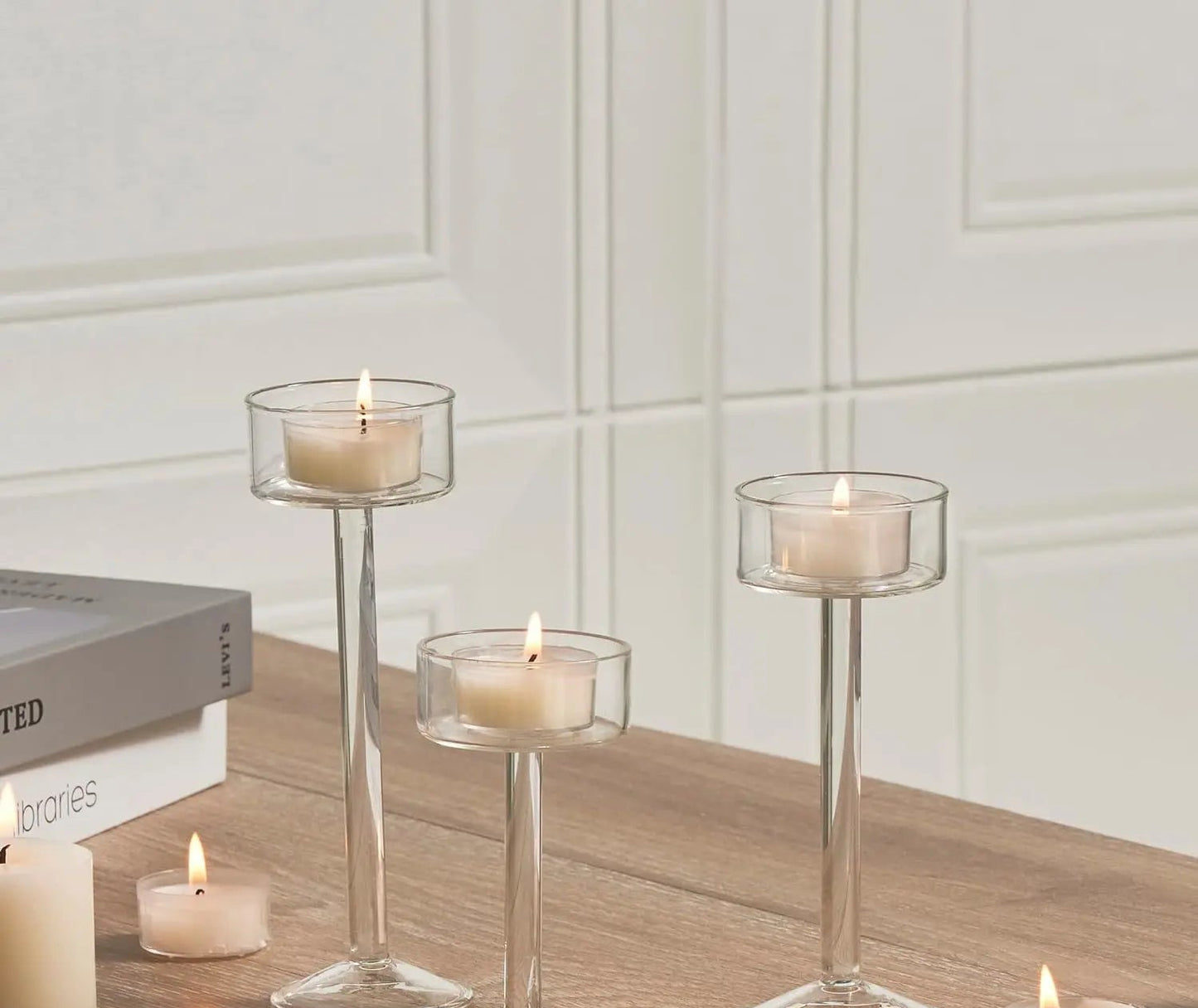 Kiu Candle Holder – set of three modern tea light holders in varying heights and colorways, perfect for creating a sleek, elegant centerpiece on tables, shelves, or mantels.