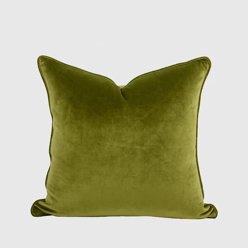A collection of Bernadette Pillow Covers in various sizes and deep jewel tones, each crafted with a luxurious velvet feel. Made from 100% polyester, these pillow covers offer a rich and sophisticated look, perfect for home décor enthusiasts. Displayed on a sofa, the covers showcase their vibrant colorways and soft texture, ideal for adding elegance and comfort to any room. Pillow inserts are not included, allowing for customizable use and styling.