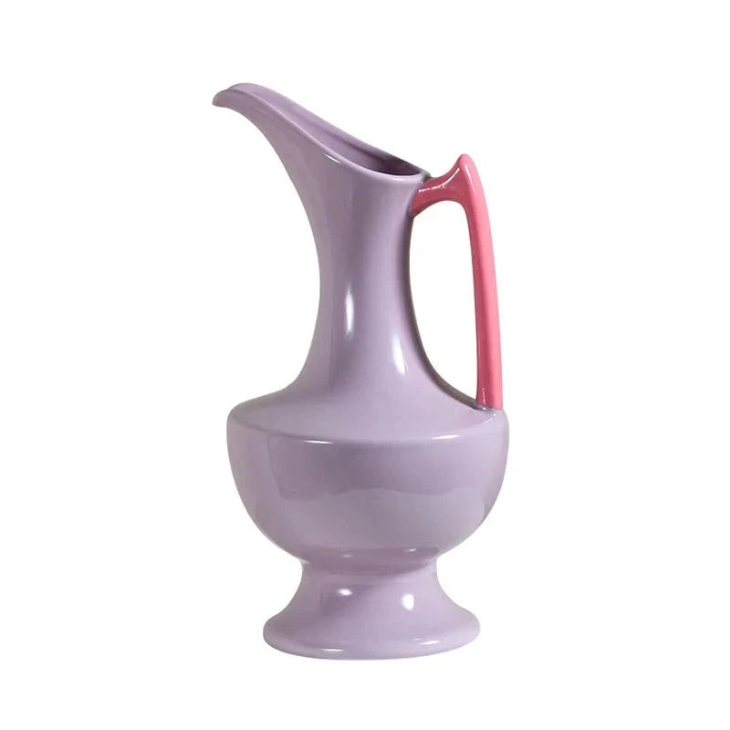 Colorful ceramic vase for floral display, bright décor accent.
