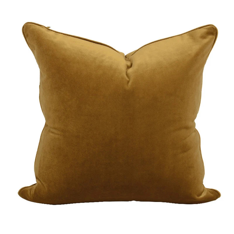 A collection of Bernadette Pillow Covers in various sizes and deep jewel tones, each crafted with a luxurious velvet feel. Made from 100% polyester, these pillow covers offer a rich and sophisticated look, perfect for home décor enthusiasts. Displayed on a sofa, the covers showcase their vibrant colorways and soft texture, ideal for adding elegance and comfort to any room. Pillow inserts are not included, allowing for customizable use and styling.