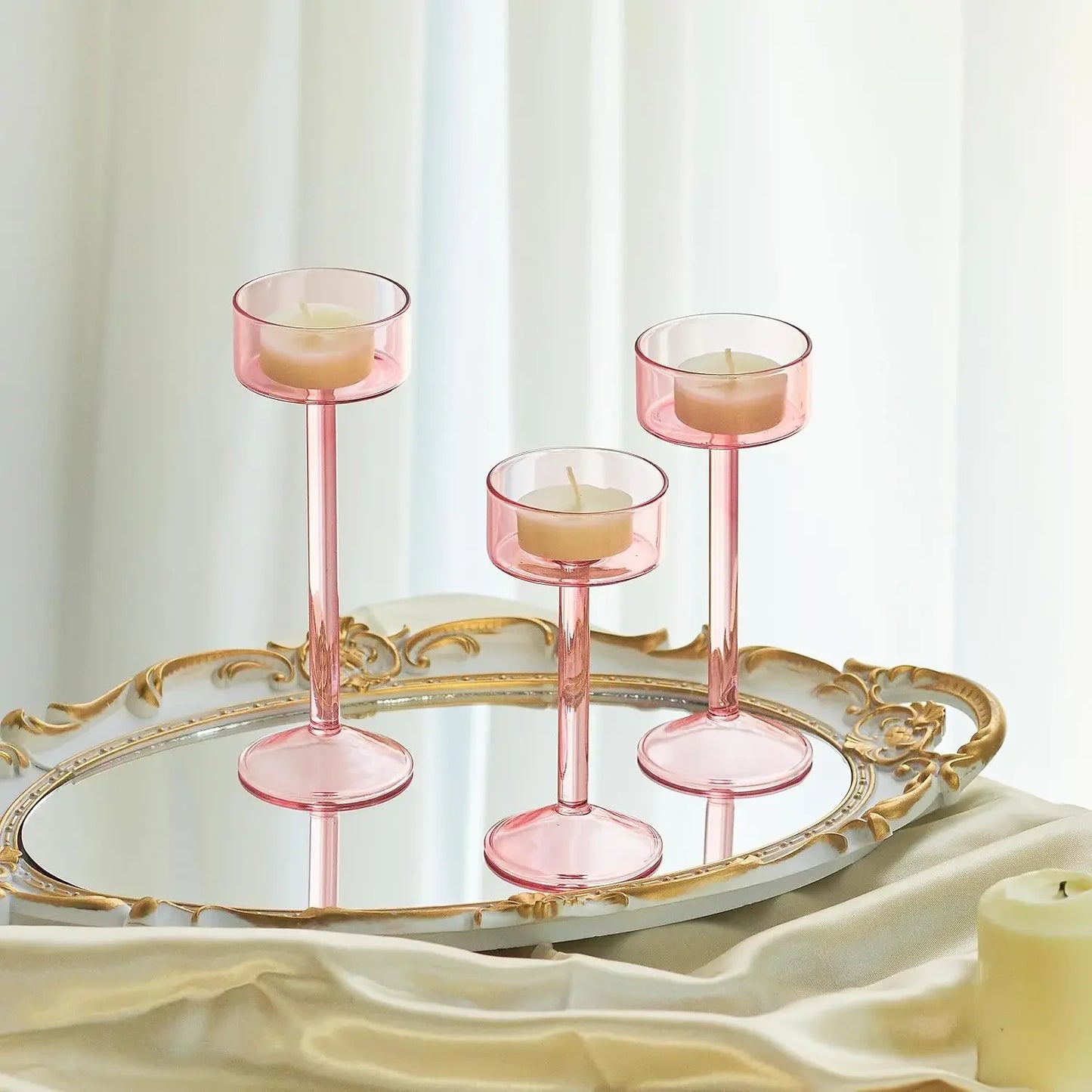 Kiu Candle Holder – set of three modern tea light holders in varying heights and colorways, perfect for creating a sleek, elegant centerpiece on tables, shelves, or mantels.