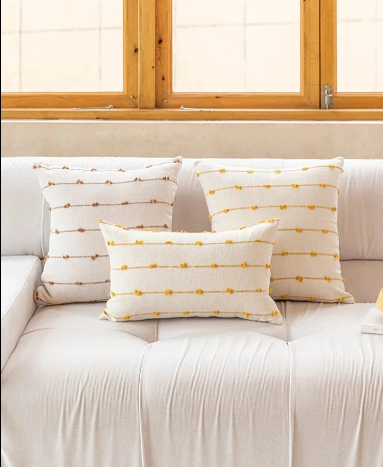 Elegant Irene Pillow Cover with cream neutral base and colored striped detailing, available in two sizes. Made from soft, high-quality cotton. Ideal for home decor enthusiasts, perfect for adding style to living rooms and bedrooms. Does not include filler.