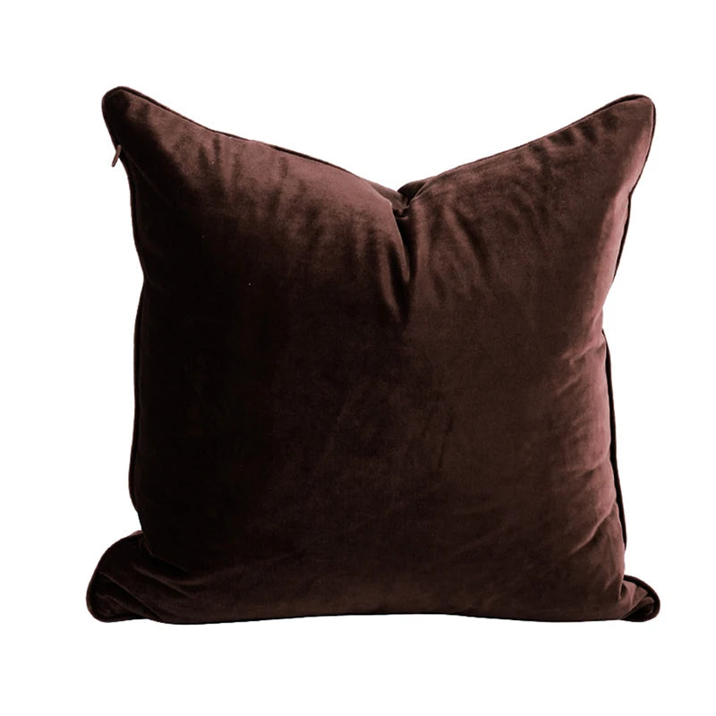 A collection of Bernadette Pillow Covers in various sizes and deep jewel tones, each crafted with a luxurious velvet feel. Made from 100% polyester, these pillow covers offer a rich and sophisticated look, perfect for home décor enthusiasts. Displayed on a sofa, the covers showcase their vibrant colorways and soft texture, ideal for adding elegance and comfort to any room. Pillow inserts are not included, allowing for customizable use and styling.