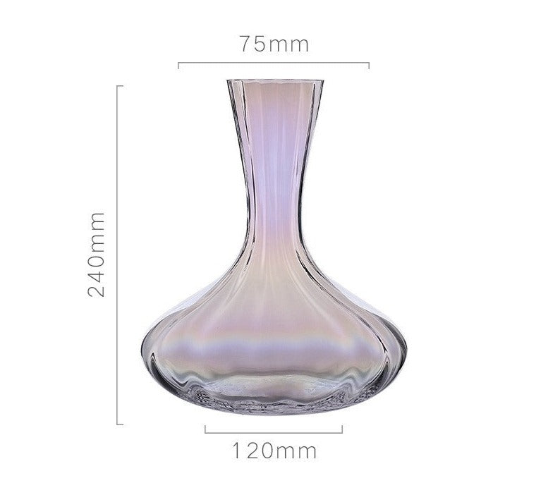 A collection of iridescent glassware from Domus Forge, featuring wine glasses, champagne coupes, decanters, and highball glasses in pastel gradient hues.