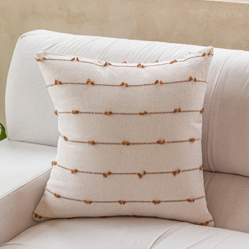 Elegant Irene Pillow Cover with cream neutral base and colored striped detailing, available in two sizes. Made from soft, high-quality cotton. Ideal for home decor enthusiasts, perfect for adding style to living rooms and bedrooms. Does not include filler.