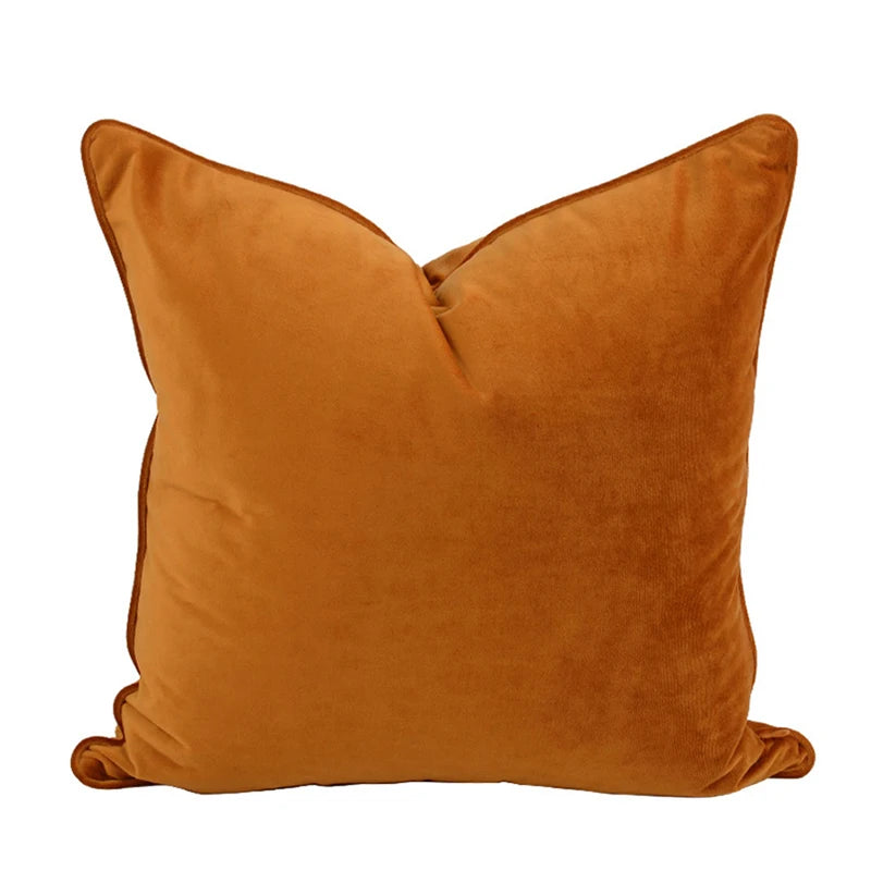 A collection of Bernadette Pillow Covers in various sizes and deep jewel tones, each crafted with a luxurious velvet feel. Made from 100% polyester, these pillow covers offer a rich and sophisticated look, perfect for home décor enthusiasts. Displayed on a sofa, the covers showcase their vibrant colorways and soft texture, ideal for adding elegance and comfort to any room. Pillow inserts are not included, allowing for customizable use and styling.