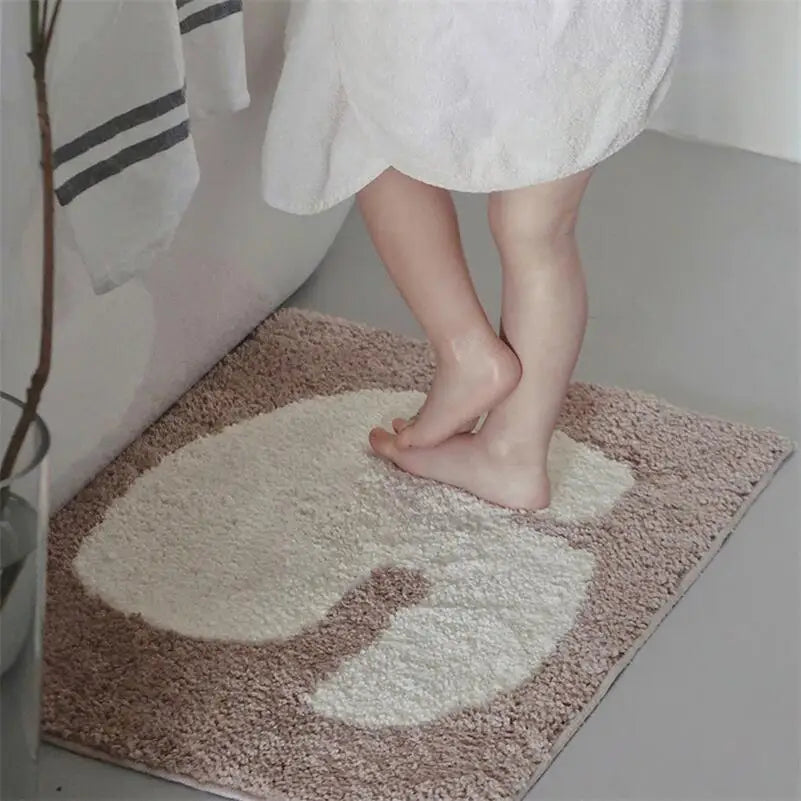 Oaklee Bath Mat featuring a plush, soft texture in various graphic styles and colors. Made from absorbent polyester with anti-slip backing, this minimalistic bath mat enhances bathroom décor while providing comfort and safety. Ideal for home décor enthusiasts seeking both style and functionality for their bathroom floor.
