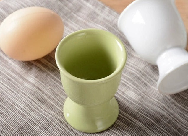Stylish ceramic egg cup for drippy or hard-boiled eggs - vibrant colors, durable design. Perfect breakfast accessory.