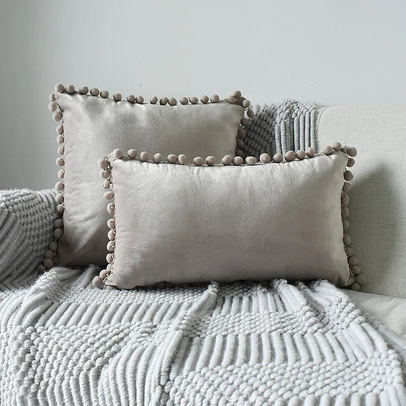 Yale Pillow Cover – luxurious velvet pillow cover with a small pom-pom border, available in multiple colors and sizes, adding a soft boho vibe to any room.
