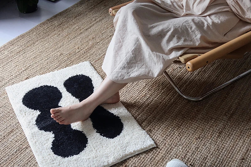 Oaklee Bath Mat featuring a plush, soft texture in various graphic styles and colors. Made from absorbent polyester with anti-slip backing, this minimalistic bath mat enhances bathroom décor while providing comfort and safety. Ideal for home décor enthusiasts seeking both style and functionality for their bathroom floor.