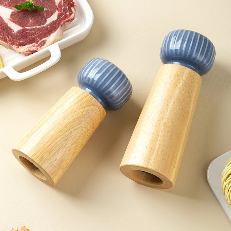 Ugalde Salt & Pepper Mill – elegant rubberwood and ceramic mills in white or indigo, featuring adjustable coarse and fine grinding, available in two sizes for a stylish kitchen upgrade.