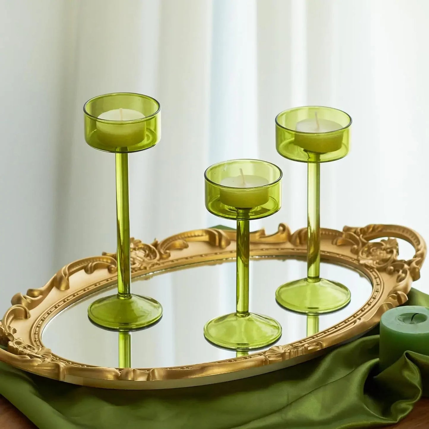 Kiu Candle Holder – set of three modern tea light holders in varying heights and colorways, perfect for creating a sleek, elegant centerpiece on tables, shelves, or mantels.