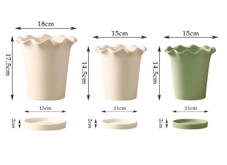 A ceramic planter with a wavy edge design, shown in a soft neutral color. The planter is available with or without a matching tray and comes in both small and large sizes, making it perfect for showcasing indoor greenery like succulents or ferns.