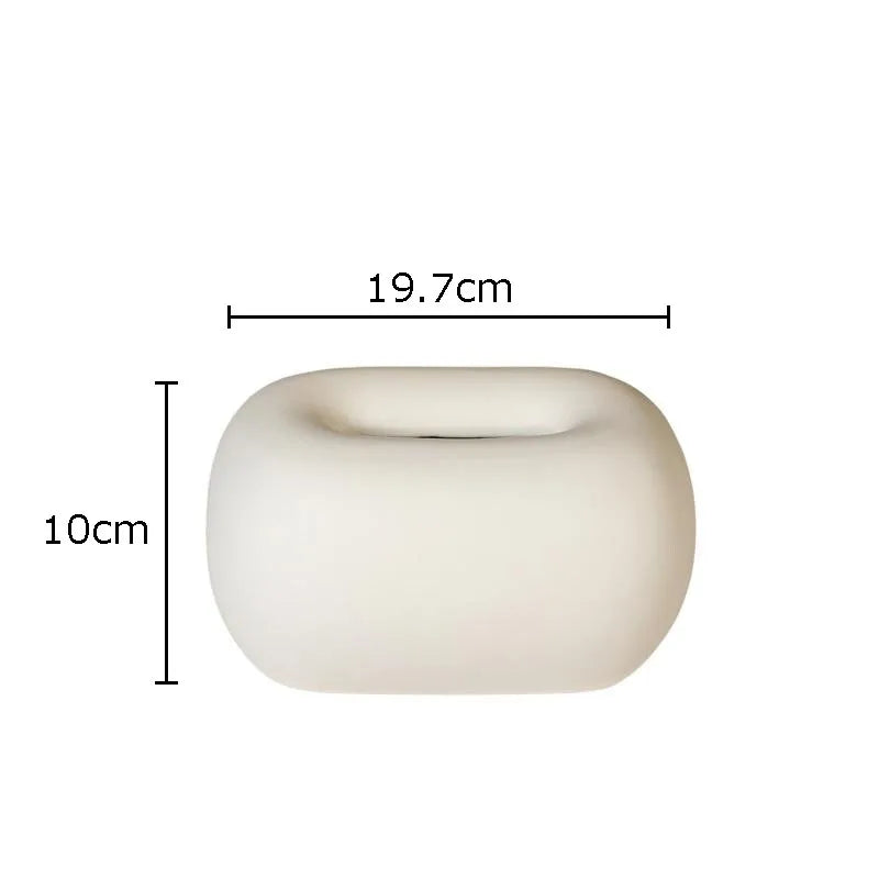 Rounded ceramic tissue box in a modern, minimalist design with four colorway options. A sleek and stylish home décor piece, perfect for living rooms, bedrooms, offices, or bathrooms.