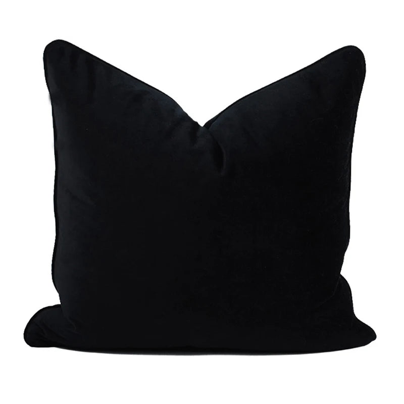 A collection of Bernadette Pillow Covers in various sizes and deep jewel tones, each crafted with a luxurious velvet feel. Made from 100% polyester, these pillow covers offer a rich and sophisticated look, perfect for home décor enthusiasts. Displayed on a sofa, the covers showcase their vibrant colorways and soft texture, ideal for adding elegance and comfort to any room. Pillow inserts are not included, allowing for customizable use and styling.