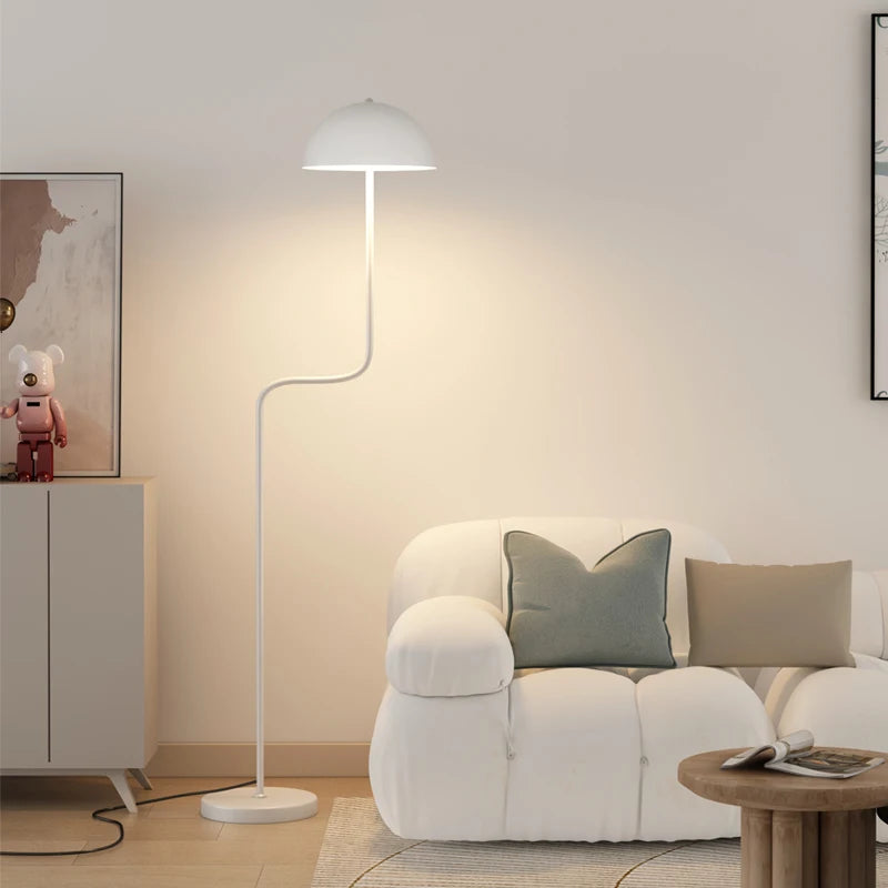 Image of the Tully Floor Lamp featuring a sleek, modern design with bright colorways. The lamp has a unique mushroom shape, made from durable metal, and includes an easy-to-use button switch. Perfect for home décor enthusiasts looking to add stylish accent lighting to their space.