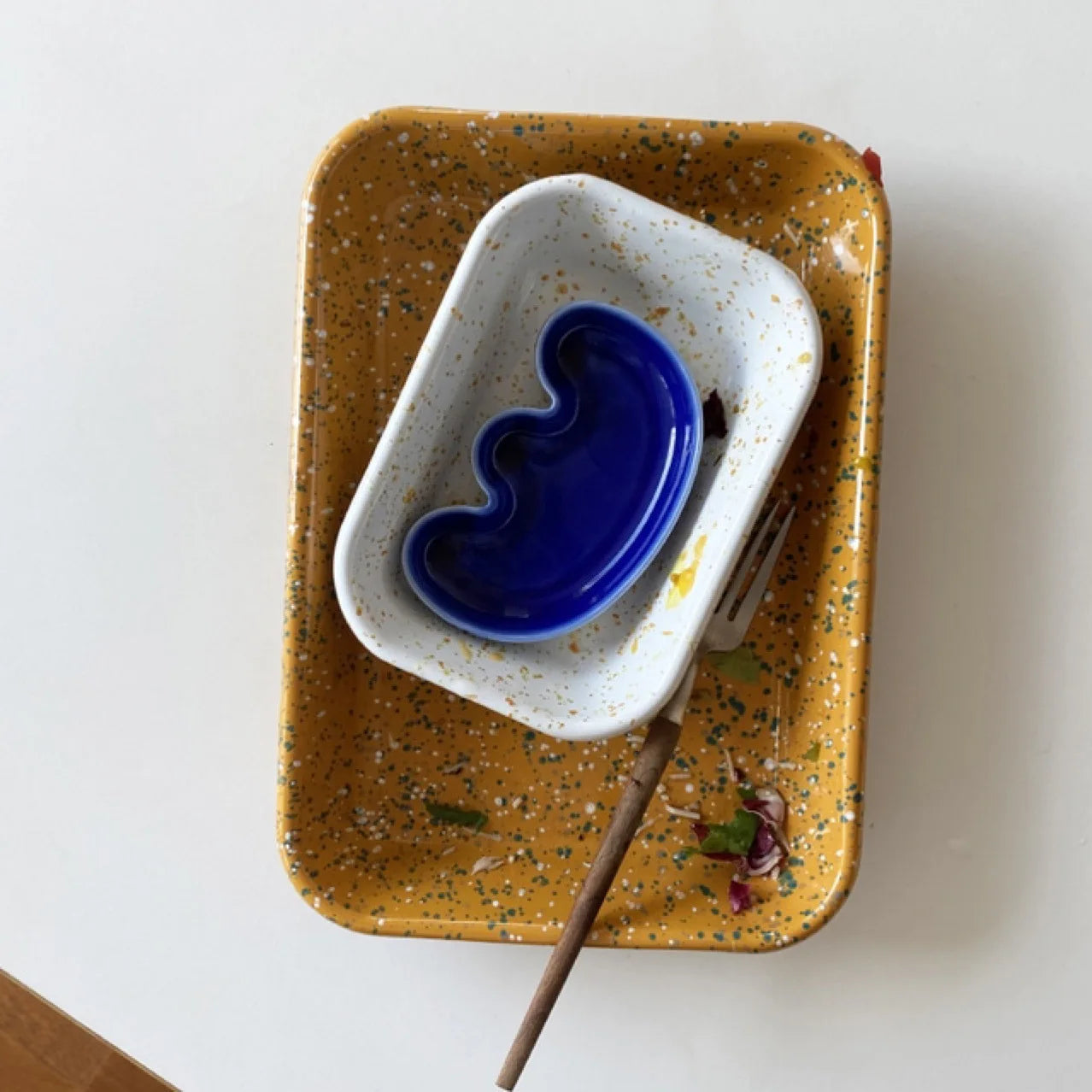 Handmade ceramic Rhett Dipping Dishes in bold vibrant colors, perfect for dipping and small bites. Four unique shapes provide versatility in presentation. Ideal for creating a mise en place. Shop now for artisanal charm in your dining experience.