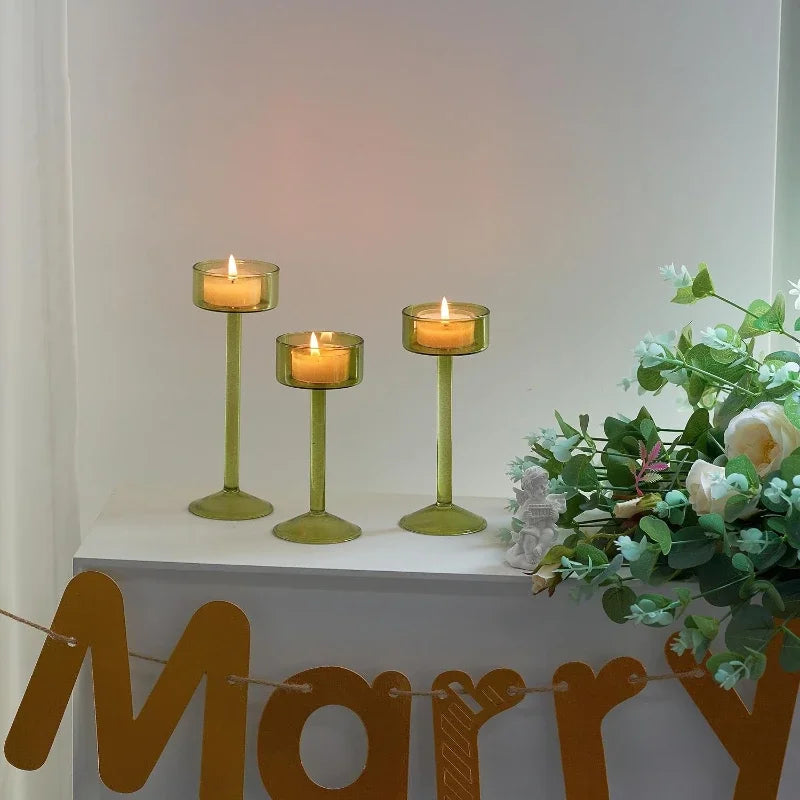 Kiu Candle Holder – set of three modern tea light holders in varying heights and colorways, perfect for creating a sleek, elegant centerpiece on tables, shelves, or mantels.
