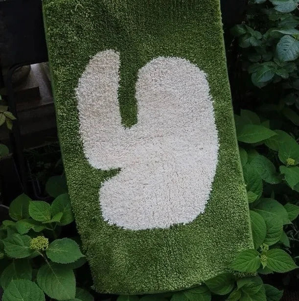 Oaklee Bath Mat featuring a plush, soft texture in various graphic styles and colors. Made from absorbent polyester with anti-slip backing, this minimalistic bath mat enhances bathroom décor while providing comfort and safety. Ideal for home décor enthusiasts seeking both style and functionality for their bathroom floor.