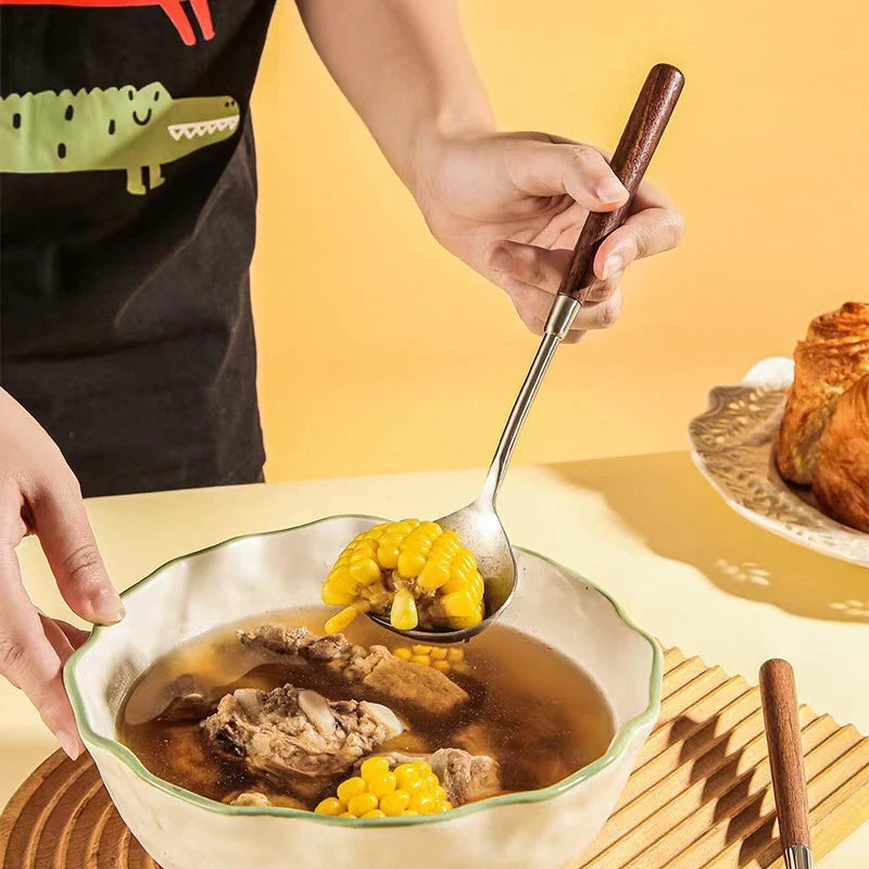 Wanda Serving Set – modern stainless steel serveware with elegant walnut handles, including a cake knife, cake shovel, serving spoon, ladle, and slotted turner for effortless entertaining.