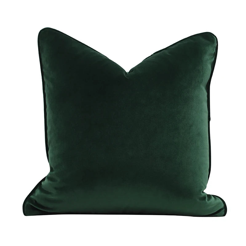 A collection of Bernadette Pillow Covers in various sizes and deep jewel tones, each crafted with a luxurious velvet feel. Made from 100% polyester, these pillow covers offer a rich and sophisticated look, perfect for home décor enthusiasts. Displayed on a sofa, the covers showcase their vibrant colorways and soft texture, ideal for adding elegance and comfort to any room. Pillow inserts are not included, allowing for customizable use and styling.