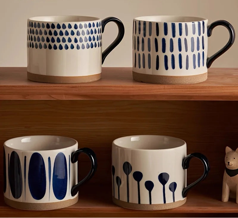 Vix Mug – 13oz cream ceramic mug with indigo-printed design, available in four unique styles, perfect for enjoying coffee, tea, or as a decorative piece.