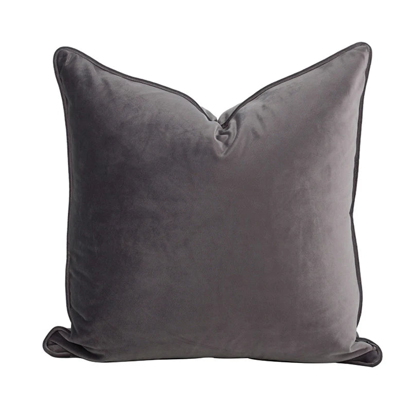 A collection of Bernadette Pillow Covers in various sizes and deep jewel tones, each crafted with a luxurious velvet feel. Made from 100% polyester, these pillow covers offer a rich and sophisticated look, perfect for home décor enthusiasts. Displayed on a sofa, the covers showcase their vibrant colorways and soft texture, ideal for adding elegance and comfort to any room. Pillow inserts are not included, allowing for customizable use and styling.