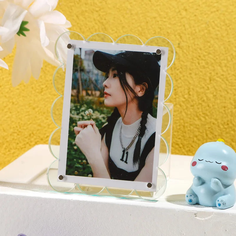 Fabio Frame featuring a scalloped design in vibrant colors, made from durable acrylic. Available in four sizes, this rectangular frame can be displayed vertically or horizontally. Perfect for home decor enthusiasts looking to add a playful and stylish touch to their space, ideal for framing art or photographs.