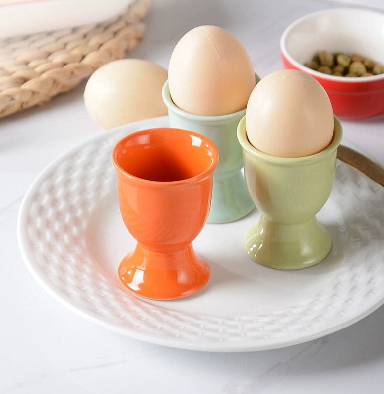 Stylish ceramic egg cup for drippy or hard-boiled eggs - vibrant colors, durable design. Perfect breakfast accessory.