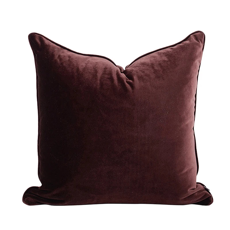 A collection of Bernadette Pillow Covers in various sizes and deep jewel tones, each crafted with a luxurious velvet feel. Made from 100% polyester, these pillow covers offer a rich and sophisticated look, perfect for home décor enthusiasts. Displayed on a sofa, the covers showcase their vibrant colorways and soft texture, ideal for adding elegance and comfort to any room. Pillow inserts are not included, allowing for customizable use and styling.