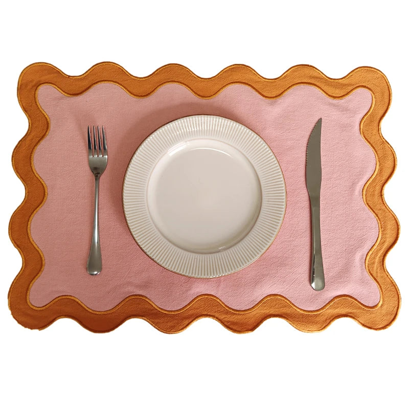 Image of the Paloma Placemat featuring a rectangular shape with a charming scalloped edge, designed for home décor enthusiasts. Made from a durable cotton double layer, it measures 35 x 50 cm and is available in four stylish colorways. Ideal for decorating dining tables with elegance and sophistication.