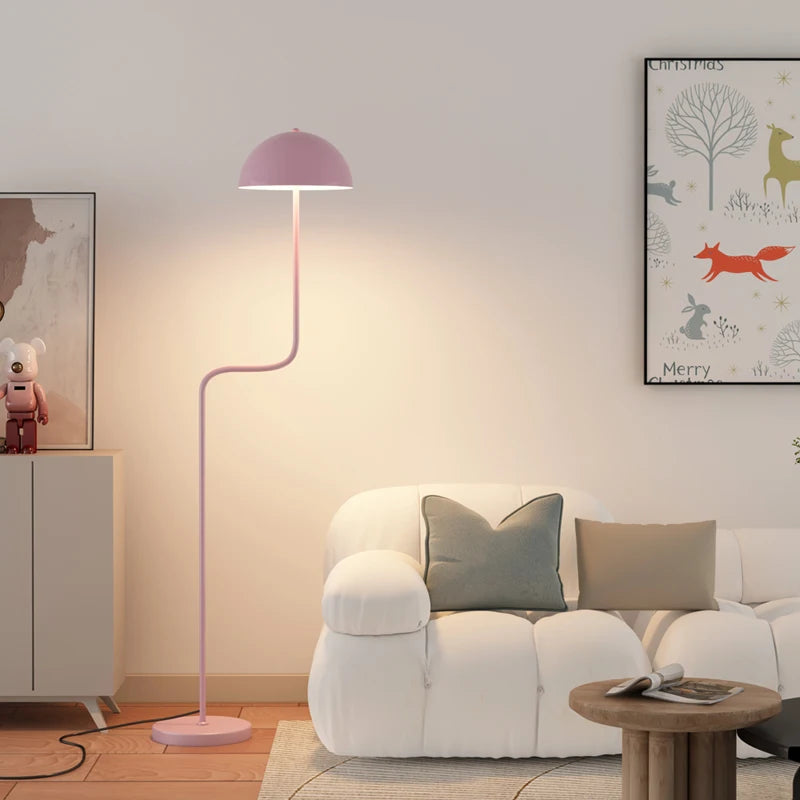 Image of the Tully Floor Lamp featuring a sleek, modern design with bright colorways. The lamp has a unique mushroom shape, made from durable metal, and includes an easy-to-use button switch. Perfect for home décor enthusiasts looking to add stylish accent lighting to their space.
