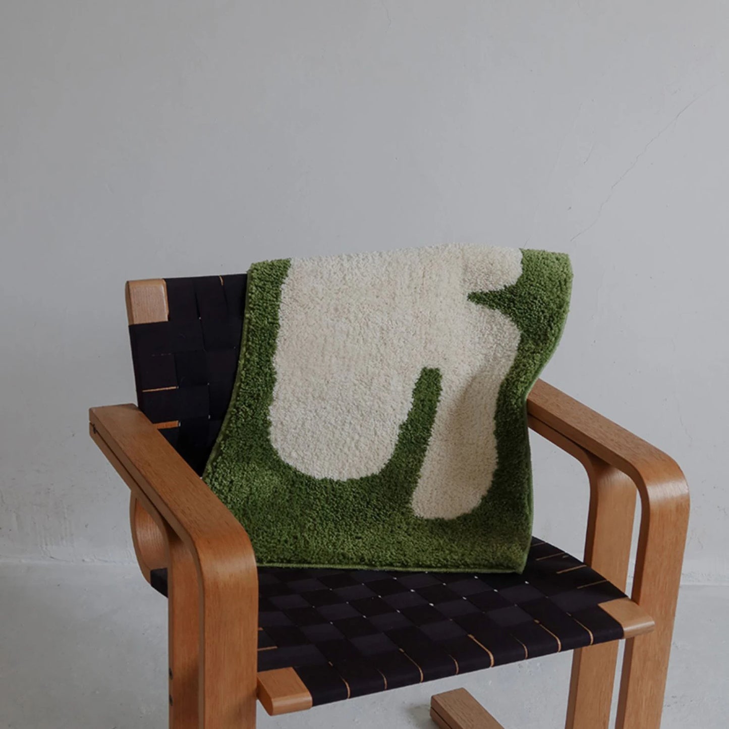 Oaklee Bath Mat featuring a plush, soft texture in various graphic styles and colors. Made from absorbent polyester with anti-slip backing, this minimalistic bath mat enhances bathroom décor while providing comfort and safety. Ideal for home décor enthusiasts seeking both style and functionality for their bathroom floor.