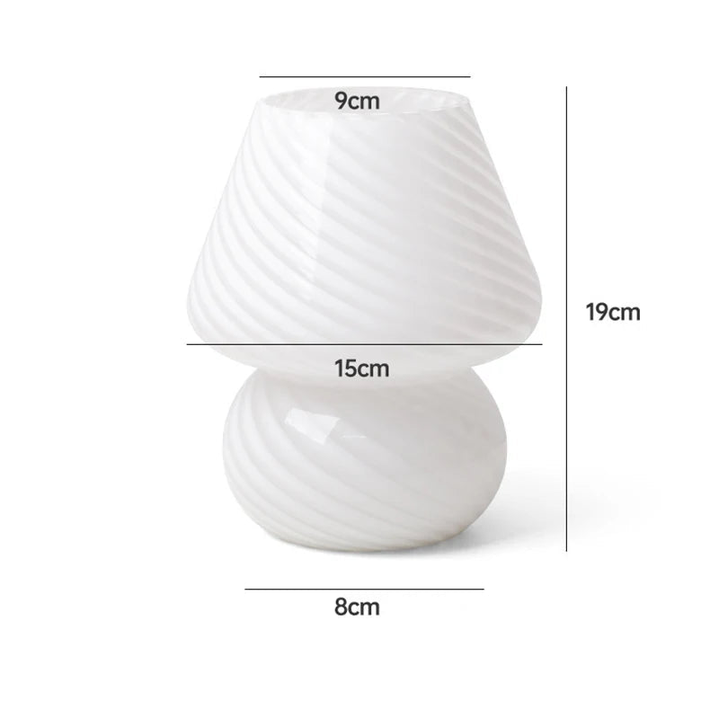 Carson Table Lamp – small mushroom-shaped glass lamp with a white base and colorful ink splat design, casting a soft, warm light for a playful and cozy ambiance.