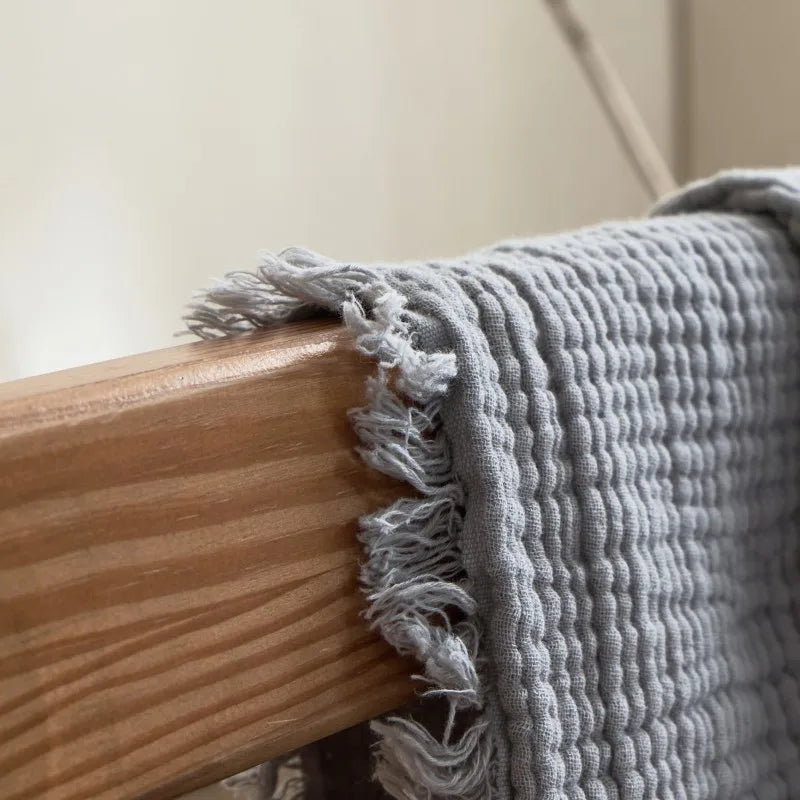 Nogu Throw Blanket – soft Maillard cotton throw with a layered gauze texture, fringe detail, and chic muted colorways, available in two sizes for cozy, stylish comfort.