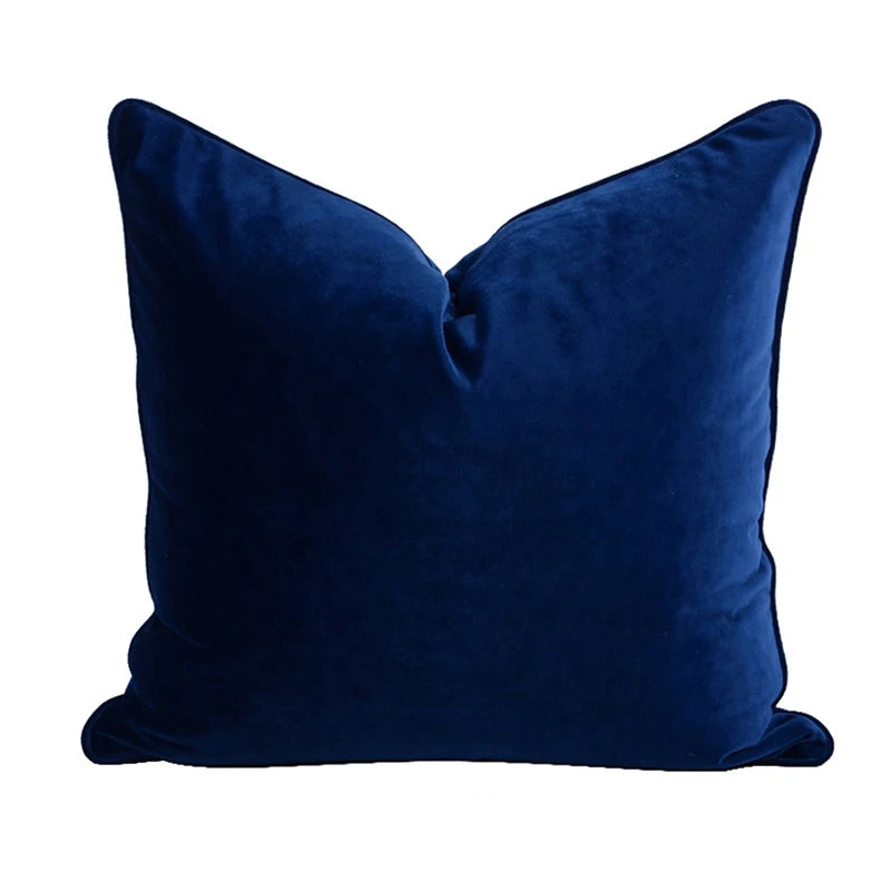 A collection of Bernadette Pillow Covers in various sizes and deep jewel tones, each crafted with a luxurious velvet feel. Made from 100% polyester, these pillow covers offer a rich and sophisticated look, perfect for home décor enthusiasts. Displayed on a sofa, the covers showcase their vibrant colorways and soft texture, ideal for adding elegance and comfort to any room. Pillow inserts are not included, allowing for customizable use and styling.