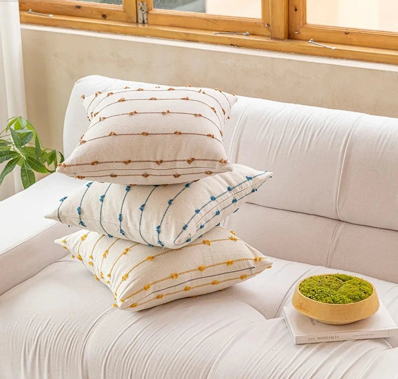 Elegant Irene Pillow Cover with cream neutral base and colored striped detailing, available in two sizes. Made from soft, high-quality cotton. Ideal for home decor enthusiasts, perfect for adding style to living rooms and bedrooms. Does not include filler.