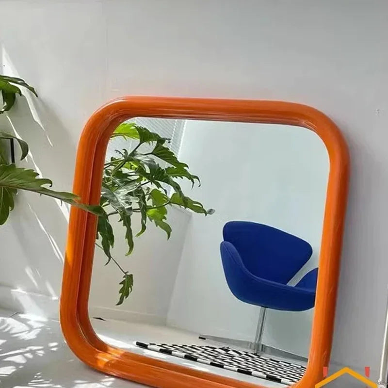 Uri Mirror – square mirror with rounded corners, vibrant colorways, and a retro-inspired design, available in small (60x60 cm) and large (80x80 cm) sizes.