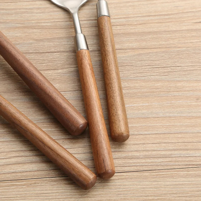 Wanda Serving Set – modern stainless steel serveware with elegant walnut handles, including a cake knife, cake shovel, serving spoon, ladle, and slotted turner for effortless entertaining.
