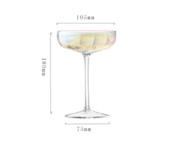 A collection of iridescent glassware from Domus Forge, featuring wine glasses, champagne coupes, decanters, and highball glasses in pastel gradient hues.