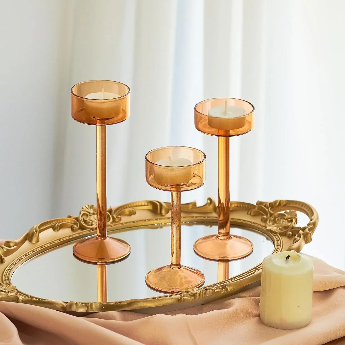 Kiu Candle Holder – set of three modern tea light holders in varying heights and colorways, perfect for creating a sleek, elegant centerpiece on tables, shelves, or mantels.