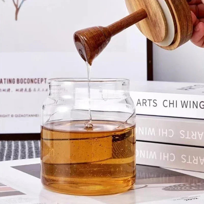 Fivel Honey Jar – elegant high borosilicate glass jar with a sealed storage design, wooden lid, and dip stick, perfect for keeping honey fresh and stylishly serving it.