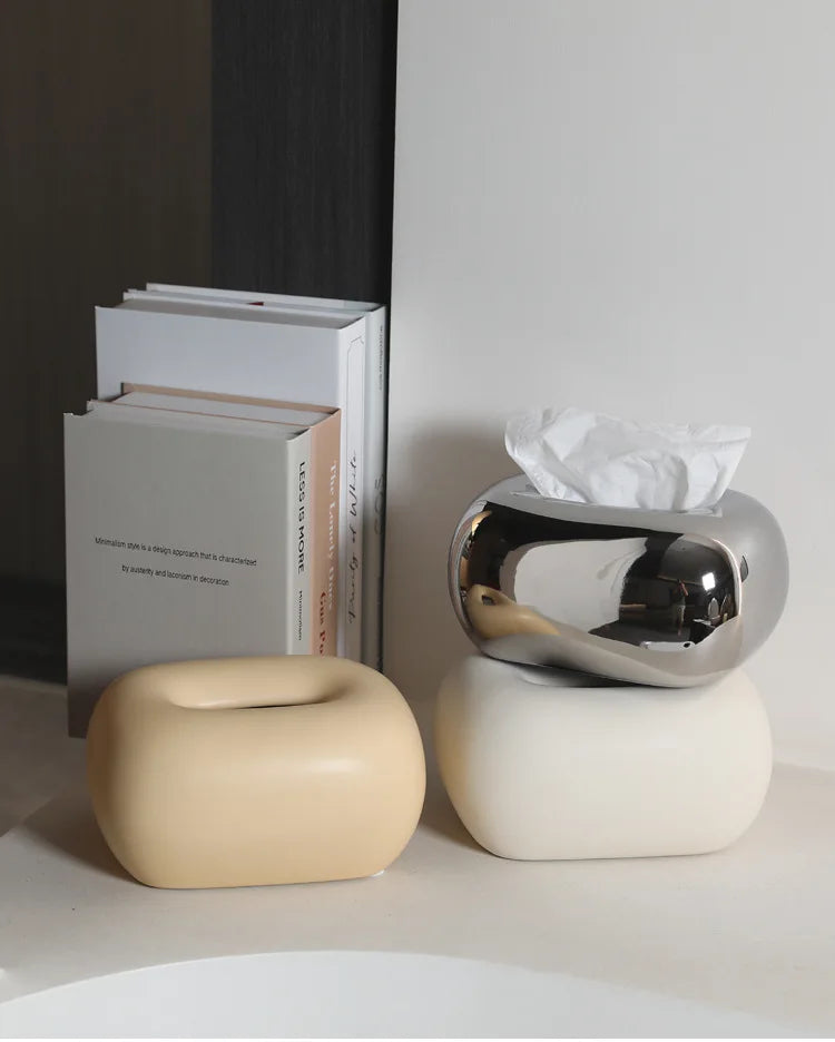 Rounded ceramic tissue box in a modern, minimalist design with four colorway options. A sleek and stylish home décor piece, perfect for living rooms, bedrooms, offices, or bathrooms.