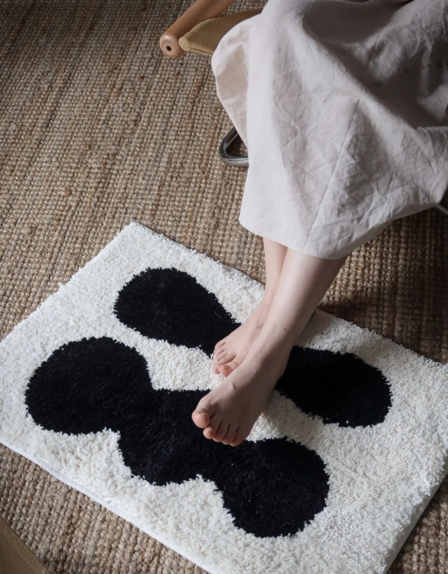 Oaklee Bath Mat featuring a plush, soft texture in various graphic styles and colors. Made from absorbent polyester with anti-slip backing, this minimalistic bath mat enhances bathroom décor while providing comfort and safety. Ideal for home décor enthusiasts seeking both style and functionality for their bathroom floor.